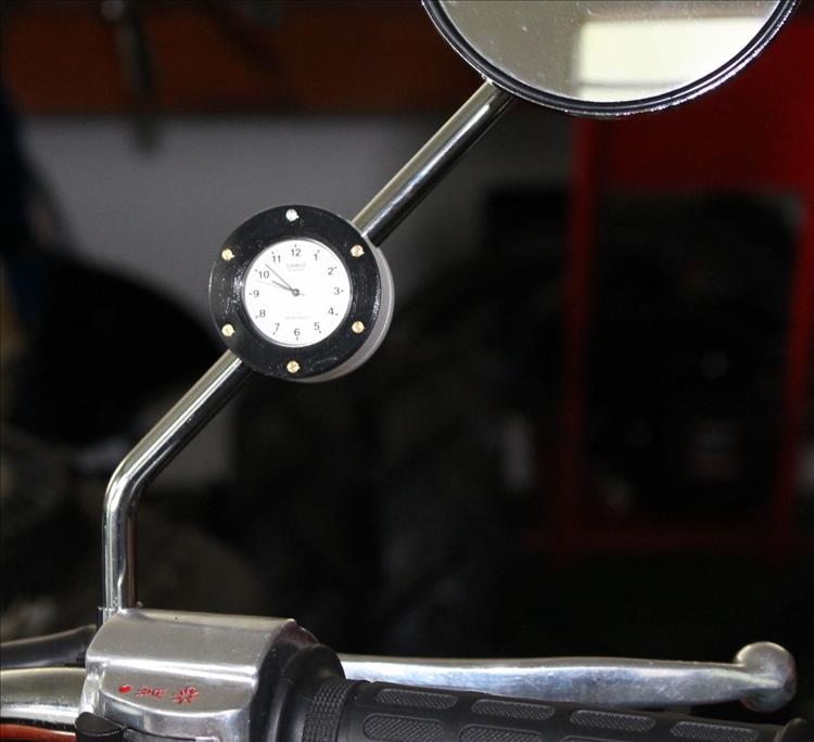 The watch in the 3d printed case secured to the wing mirror's stem, looking very smart