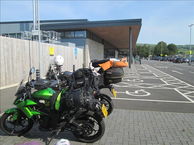 The Z250SL and CB500X loaded with luggage in the car park at Carlisle Sainsburys
