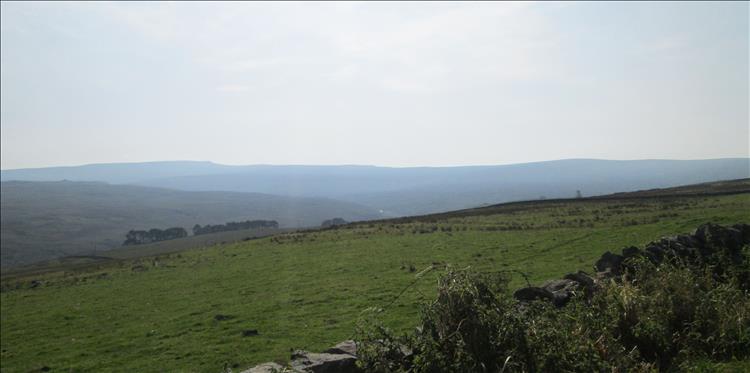 The rolling hills, hazy in the sun, in the North Pennines