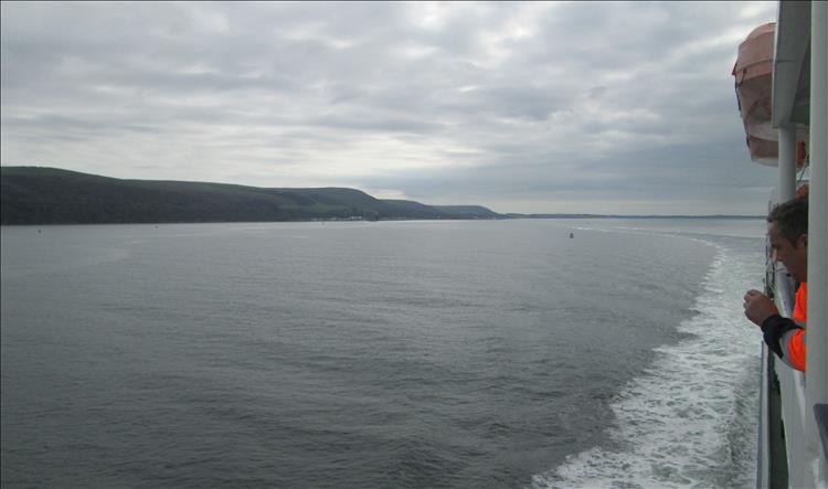Looking out from the ferry we see the receding land of the Scottish coast