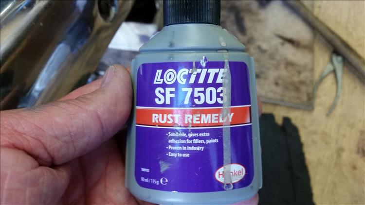 A small bottle in bogger's hand of loctite rust remedy