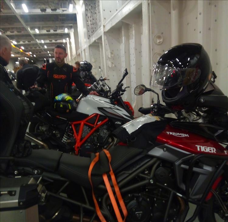 Large Triumph Tiger and various other big motorcycles on the ferry