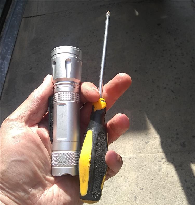 A regulart torch and phillips screwdriver