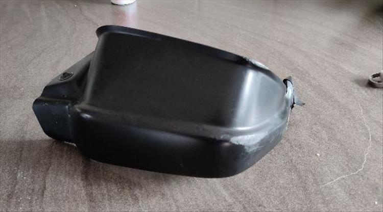 A plastic motorcycle hand guard in black