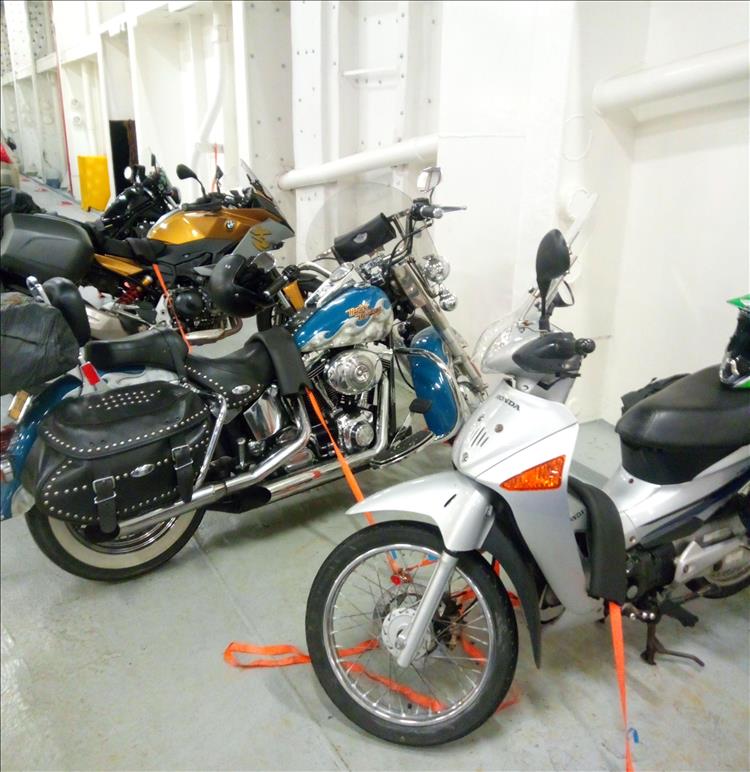 The small Innova and a big chrome Harley in the bowels of the ferry