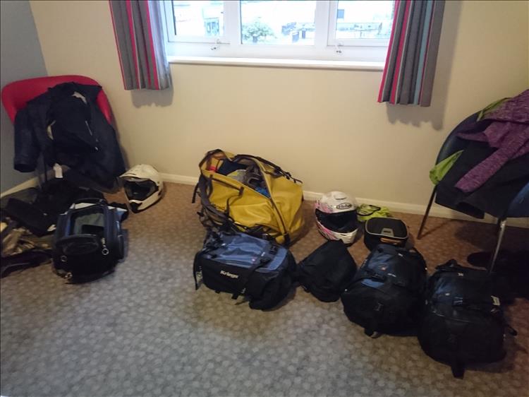 The luggage and bike gear spread over the floor of the travelodge in Dumfries