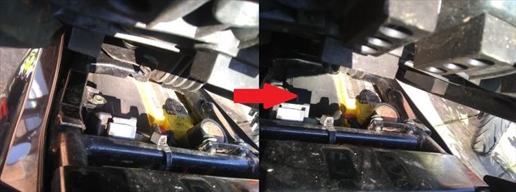 2 images showing the tongue going under the tank brace