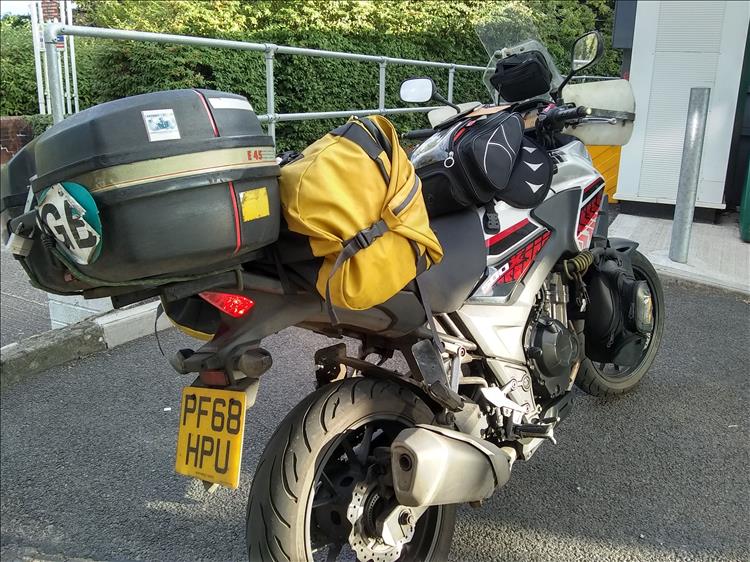 A bag and tank bag on Ren's motorcycle