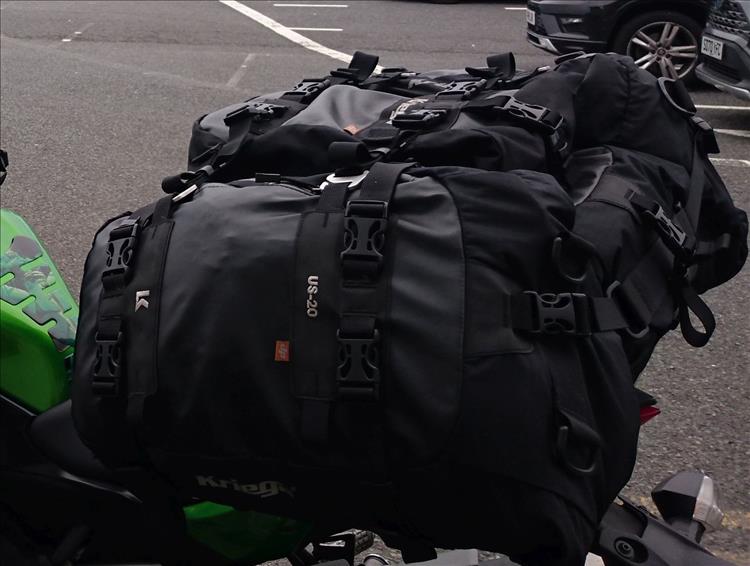 4 bags on the back of Sharon's motorcycle.