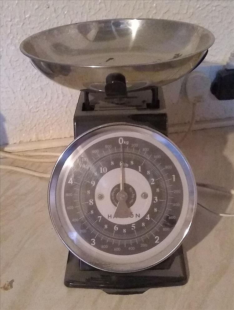 A set of kitchen scales, metal with a tradition dial and look to them