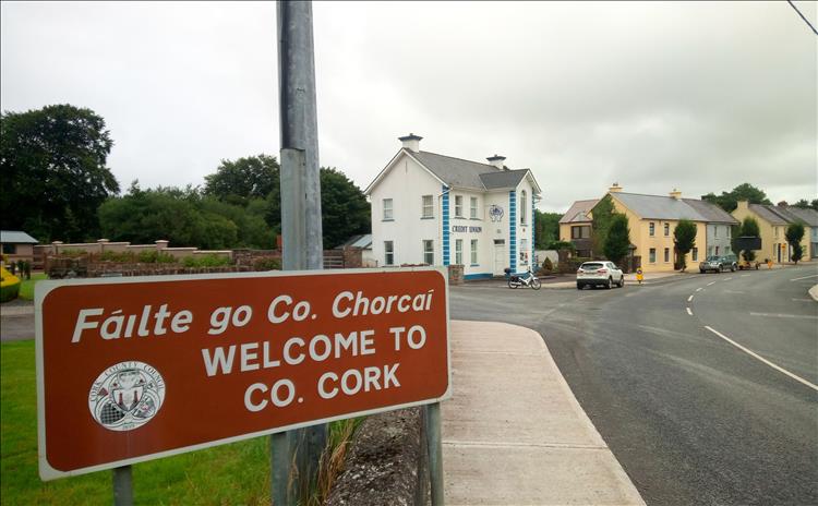 The sign reads failte go co. chorcai or Welcome to Co. Cork