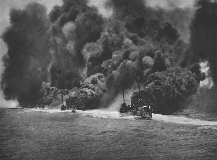 Warships making a thick black smoke screen