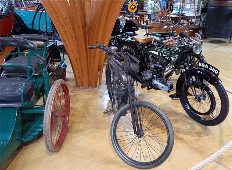3 vintage motorcycle on display