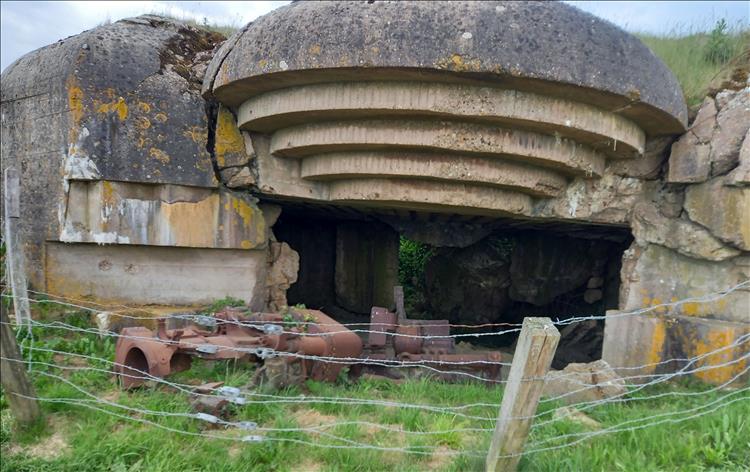 A massive huge concrete bunker, damaged and cracked