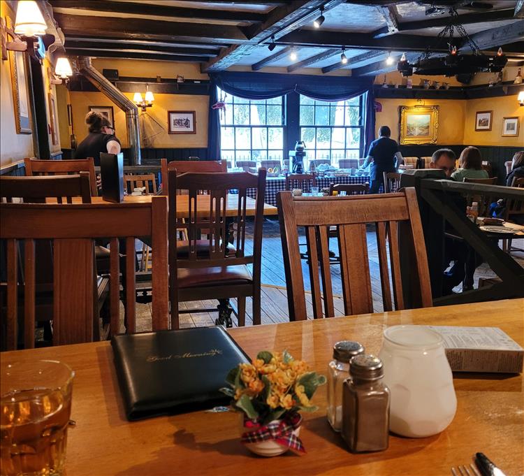 The dining area at the Village Inn is old with wooden beams and a medieval style