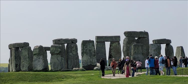 Stonehenge with people a little closer than we can get from the footpath