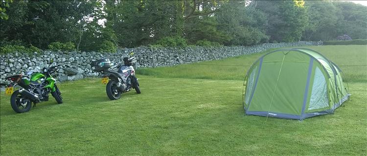 Sharon and Ren's bikes and their tent in a field in wales