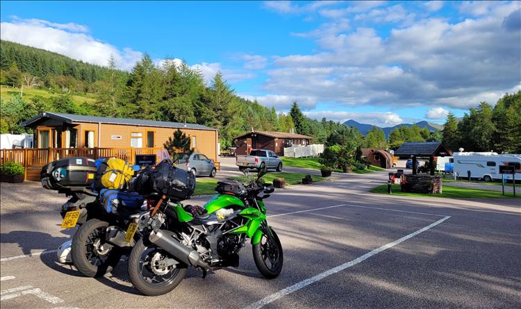 The 2 bikes and the pods and scenery at Tyndrum holiday park