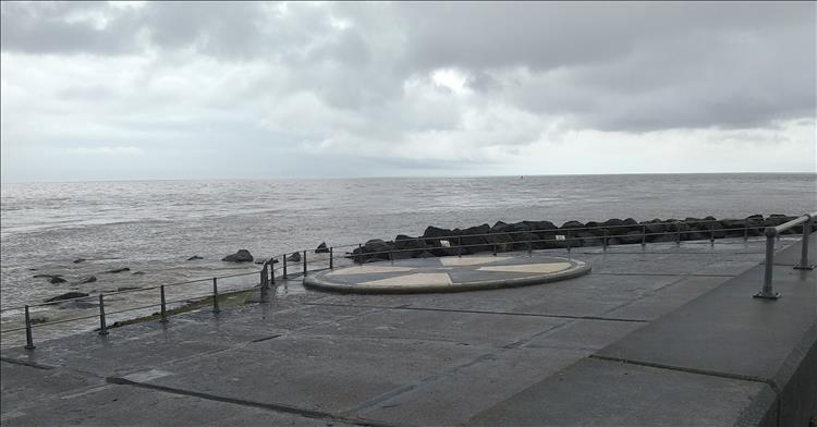 Out on a concrete area is a large circle with black and white segments at Ness Point