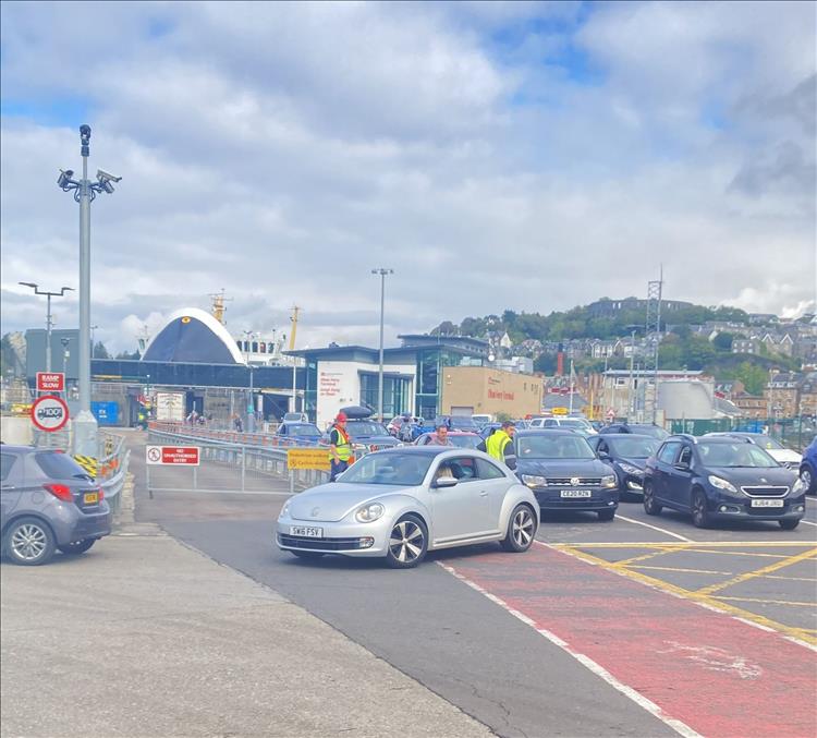 The busy terminal at Oban with cars and buildings and boats