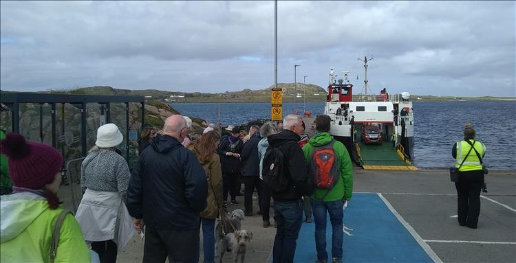 A throng of foot passengers await to get on the ferry to Iona