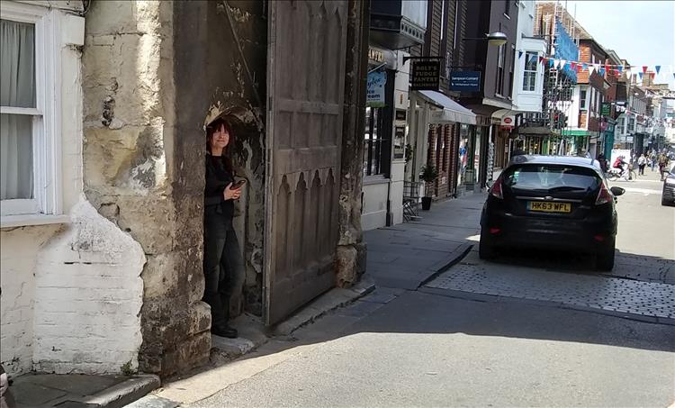 Sharon fills a tiny door in the entrance to the cathedral area