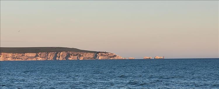 Across the water we see grass topped white cliffs and a few outcrops of white rocks