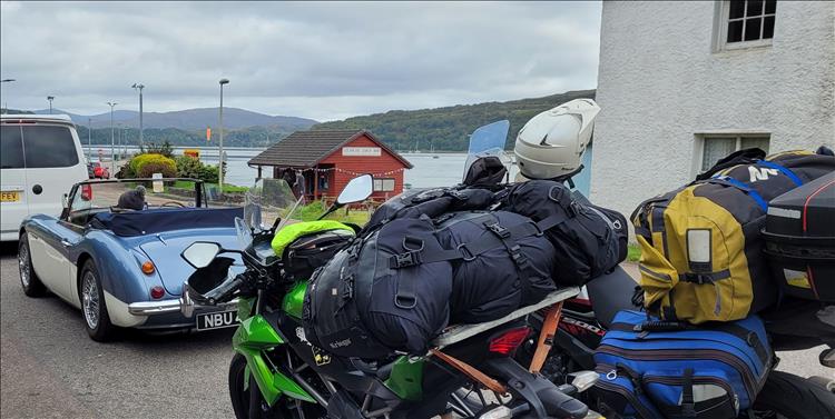 The vintage car, our 2 loaded motorcycles and the scenic lock while waiting for the ferry at Lochaline.