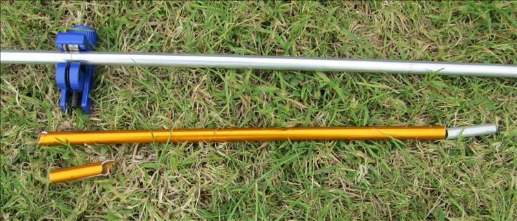 A snapped alloy tent pole and a new one being cut to length