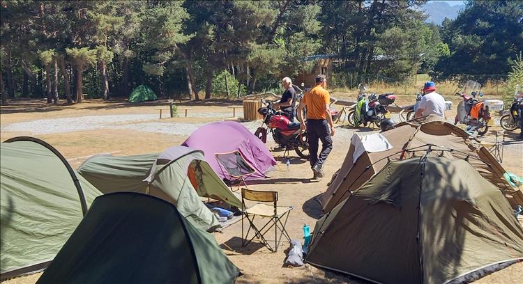 The tents, the 125cc motorcycles, the sunshine and the blokes getting ready to ride out