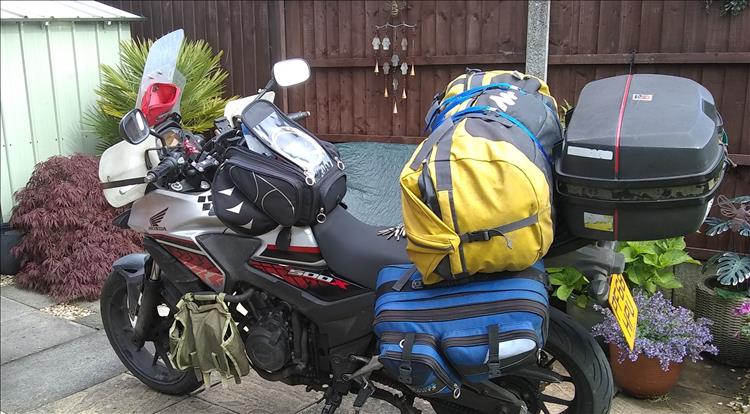Ren's CB500X with full luggage looking scruffy and dirty