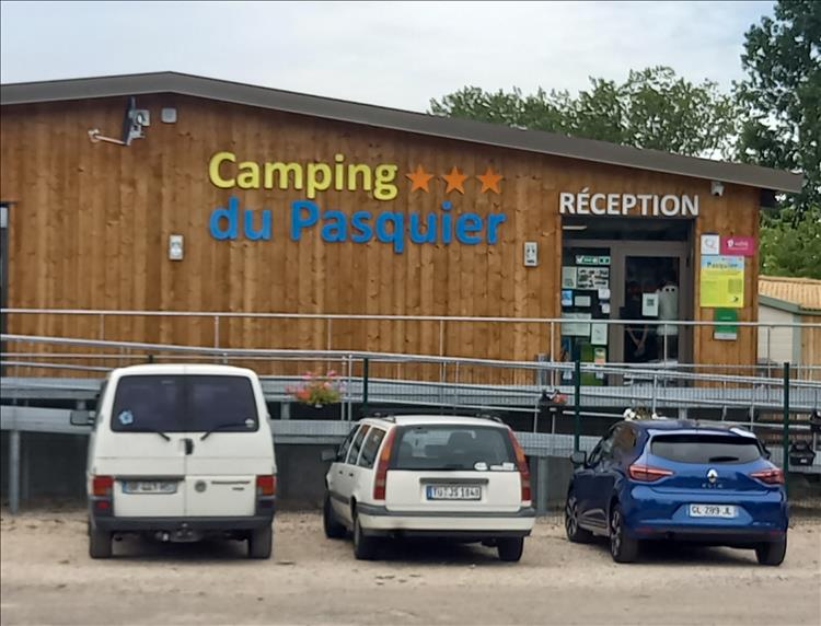 A large wooden clad reception building with the name emblazoned across the front