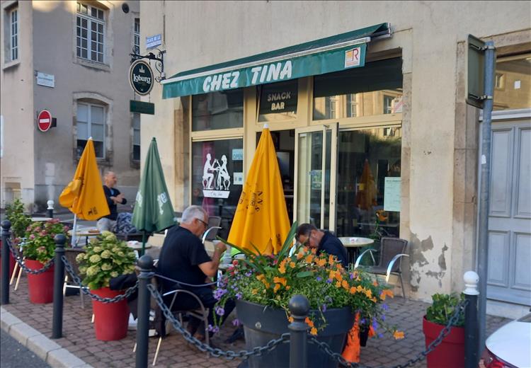 A simple cafe in Dole, France, proudly showing Chez Tina as it's name