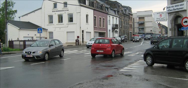 A regular scene in Europe with cars driving on the right side of the road