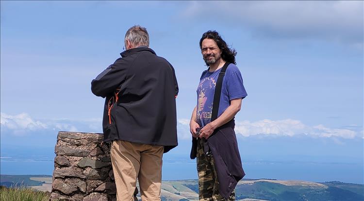 Ren and Mark look out to the scenery and South Wales from across the Severn estuary