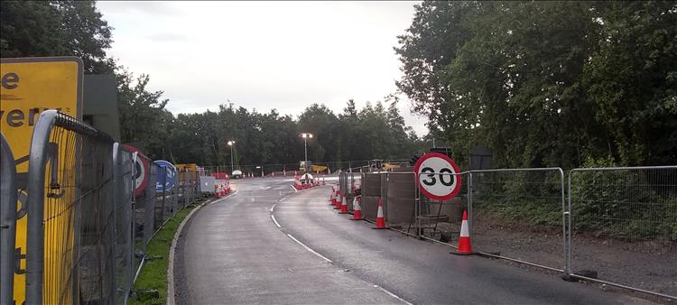 A big 30 sign, wire fencing, and roadworks just outside the entrance of the campsite