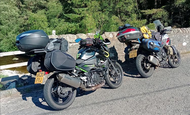 Both the Kawasaki Z400 and Honda CB500X fully laden with camping luggage for the week