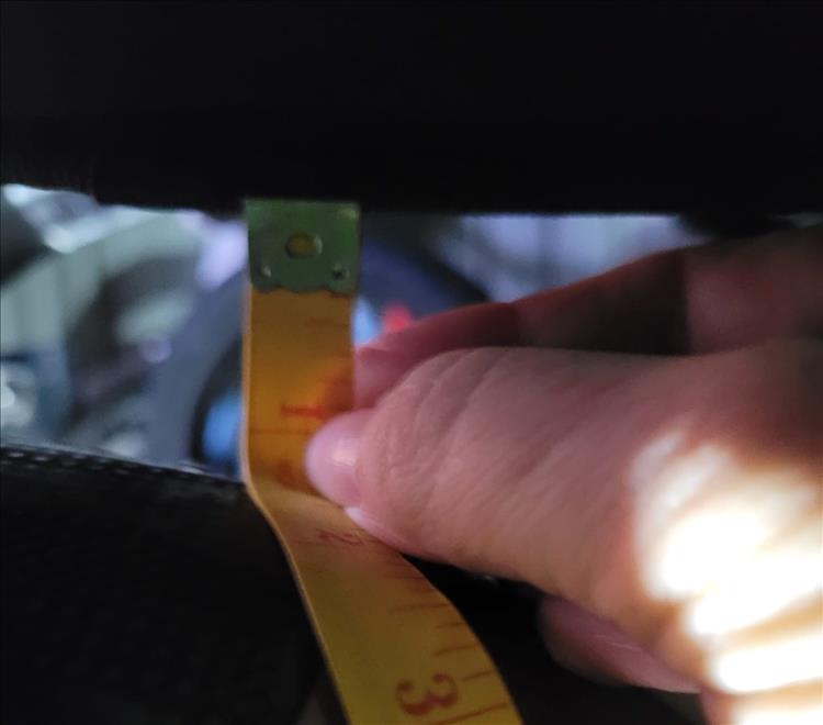 Sharon measures over an inch of clearance between the bag and the exhaust