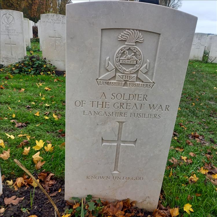 The gravestone is marked with "A soldier of the great war"