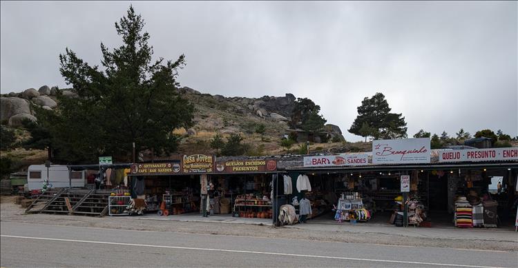 A long low almost market stall kind of place near the hilltop and the road