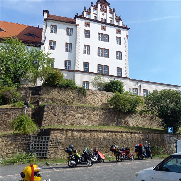 The infamouse Colditz castle - a tall white painted and smart looking building