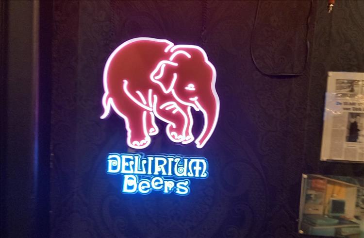 The logo of Delirium Beers with elephant in neon