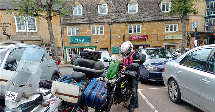 Sharon and the bikes and honey stone shops at Moreton in Marsh