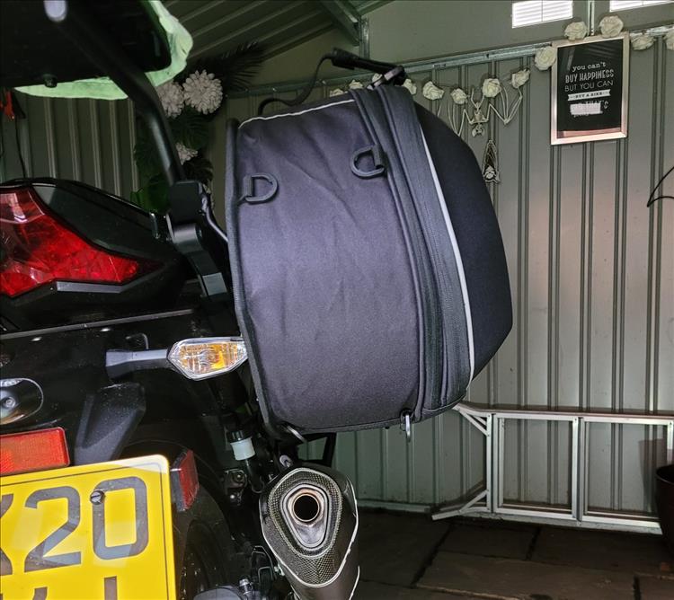 The pannier fits with acceptable clearance from the exhaust