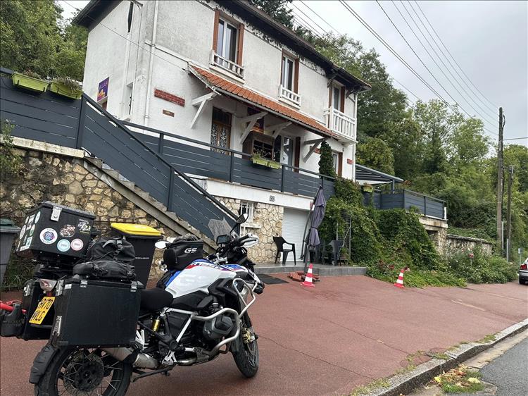 A French house on the hillside and Andy's GS1250 ready to leave