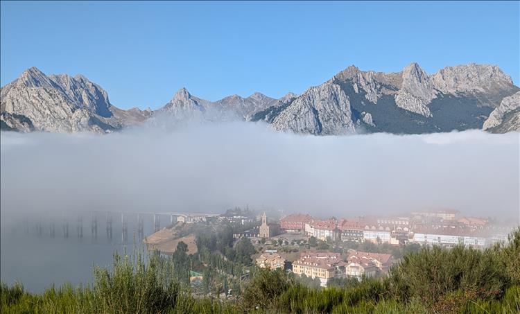 The town of Riano can be seen below as the mist is slowly clearing