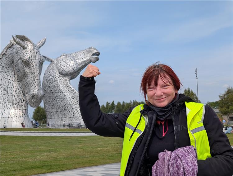 Using forced perspective it looks like Sharon is punching on of the Kelpies in the chin