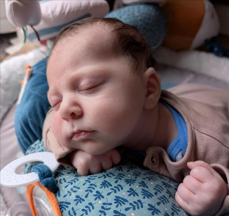 Sharon's grandchild, a young baby