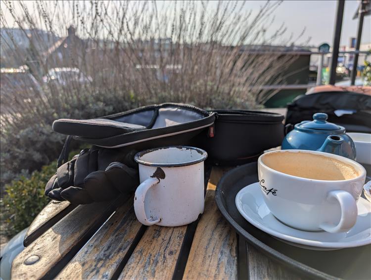 Tea pot, cups and tank bags in the sunshine at the cafe in Belper