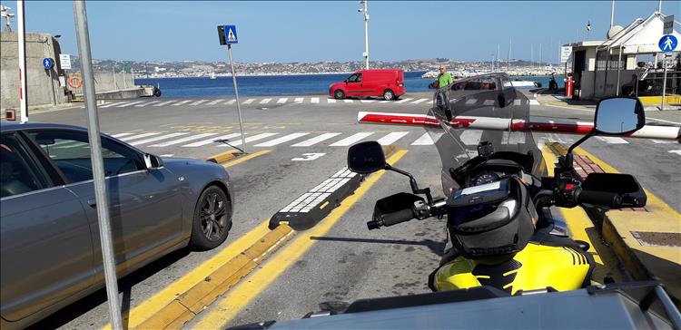 The bright yellow of the tank, the screen and beyond the port before the crossing